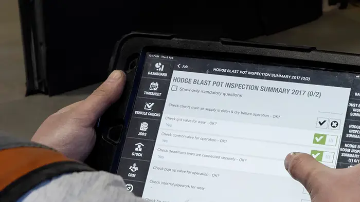 Engineer inspecting blast pot