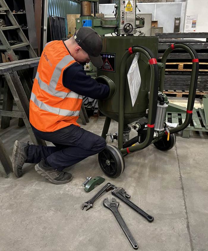 man servicing a machine