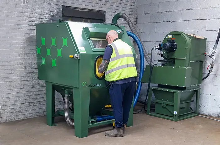 Engineer installing IND1250COMPXM pressure cabinet system at Red Rhino 